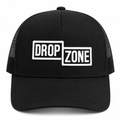 Front angled view of Drop Zone Mesh-Back Trucker Golf Cap in Black