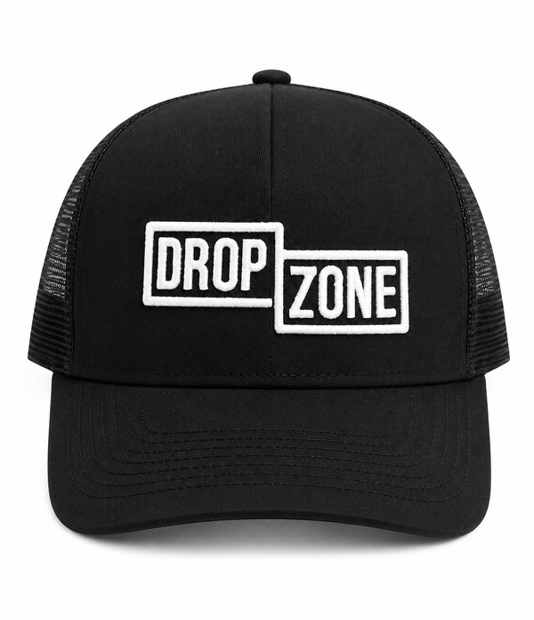 Front angled view of Drop Zone Mesh-Back Trucker Golf Cap in Black