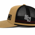 Back view of Drop Zone Side-Stripe Trucker Golf Cap in Tan & Black, showing the adjustable closure