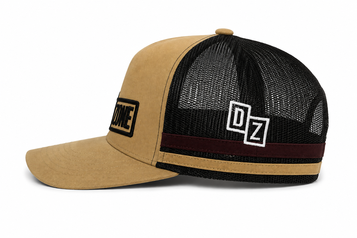 Back view of Drop Zone Side-Stripe Trucker Golf Cap in Tan & Black, showing the adjustable closure
